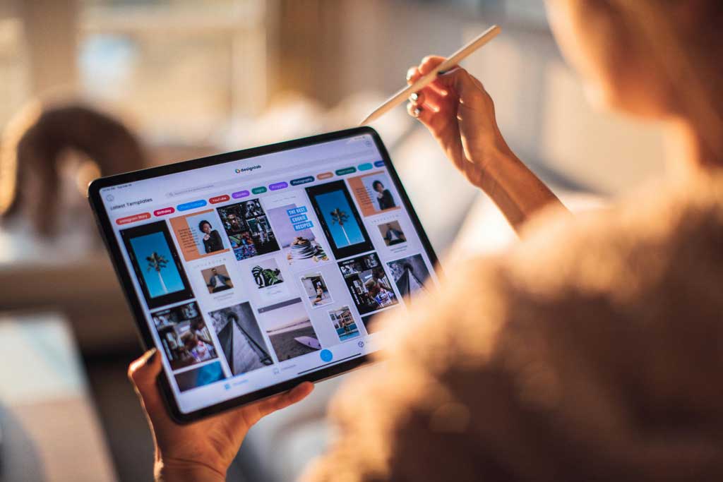 Women Holding Tablet Computer