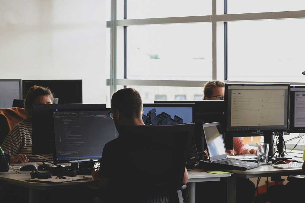 People sitting on chair in-front of computer
