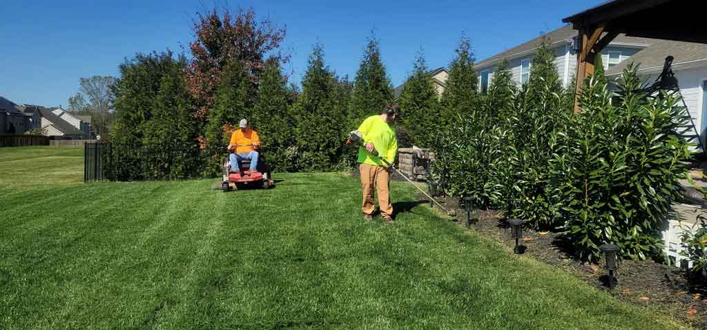A man mowing a lawn