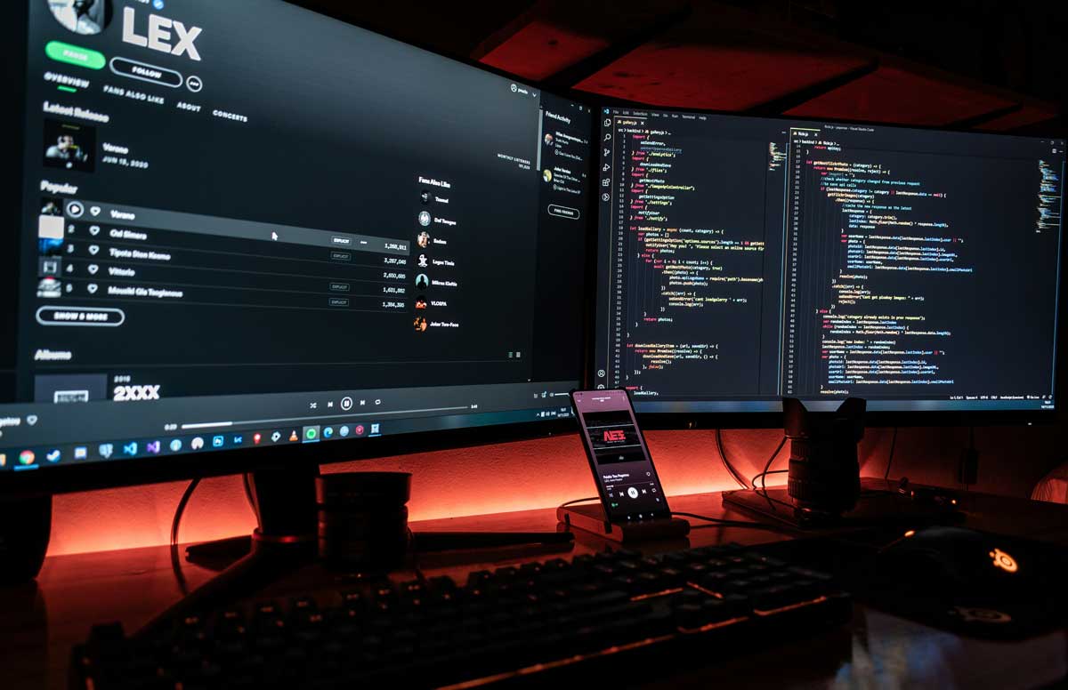 Two black flat screen computer monitor