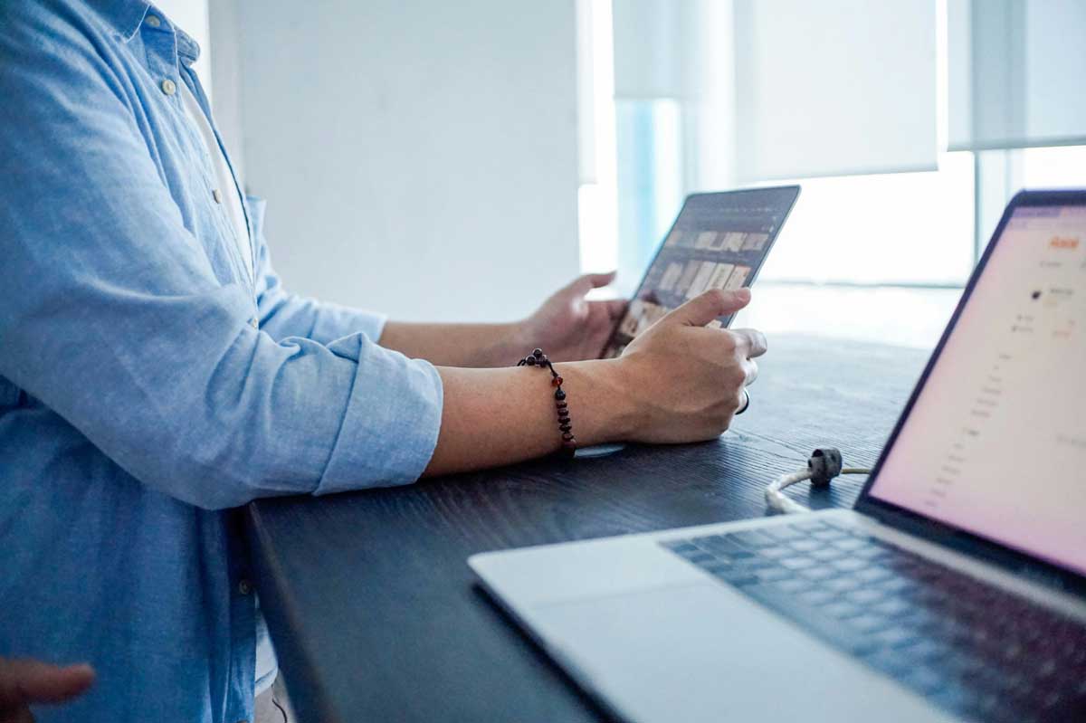  A person sitting in-front of a laptop computer