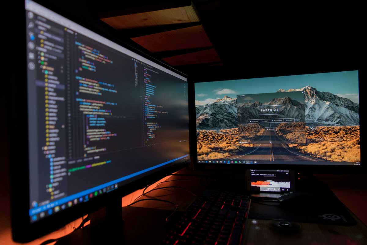 Two black flat screen computer monitors