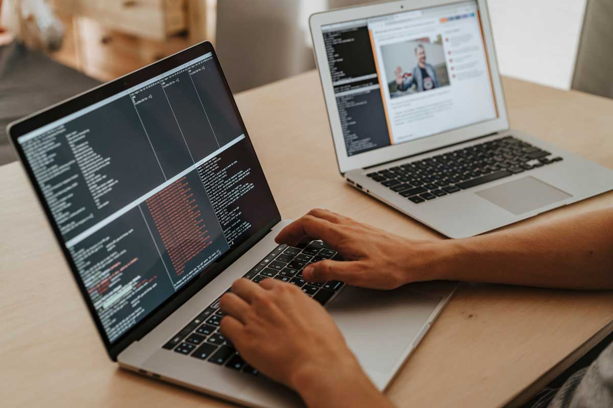  developer working on a laptop, typing code, showcasing programming and technology skills