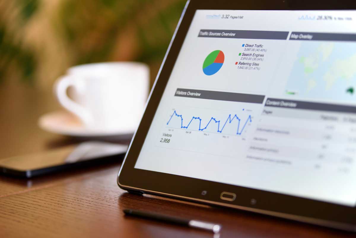 Close-up of a tablet displaying analytics charts