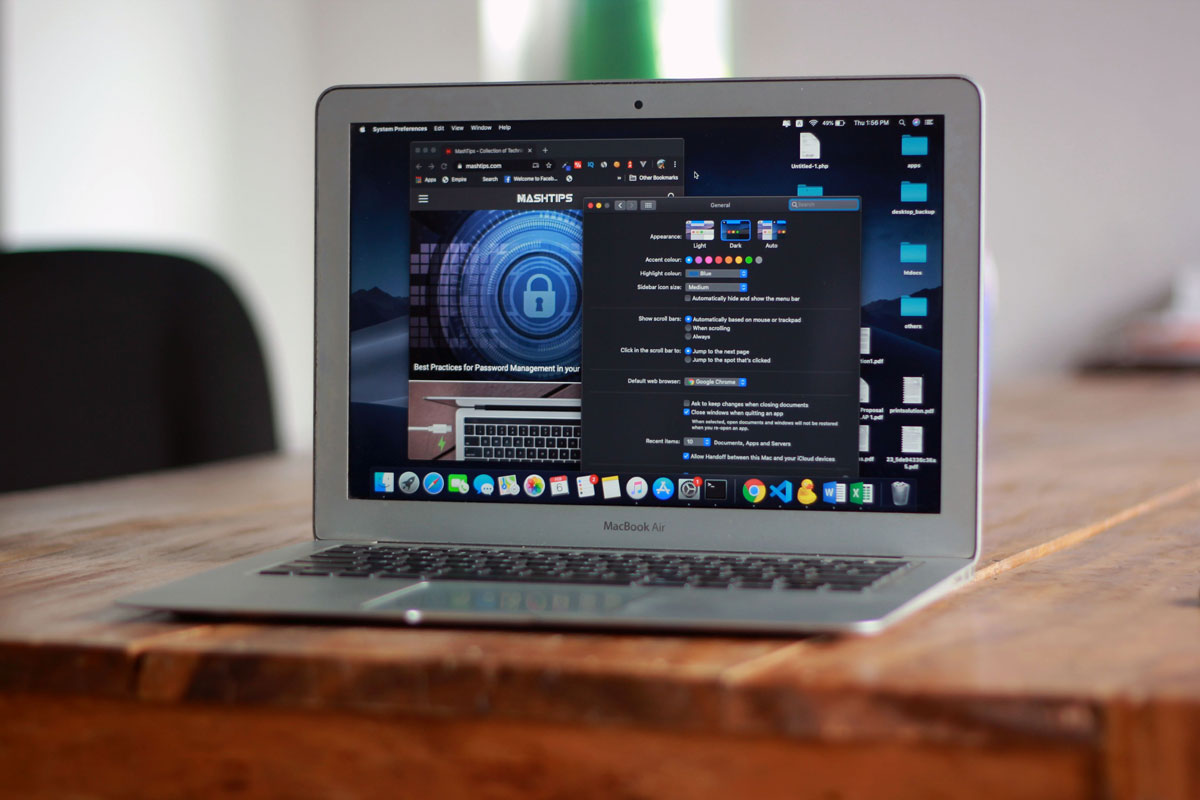 Open MacBook Air with apps and web browser on screen