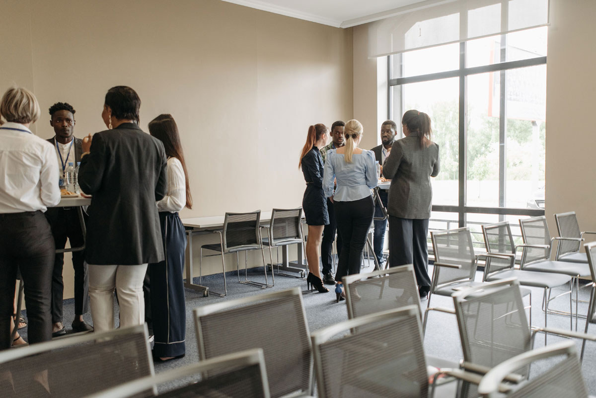 Professionals engaging in a casual networking session during a business conference