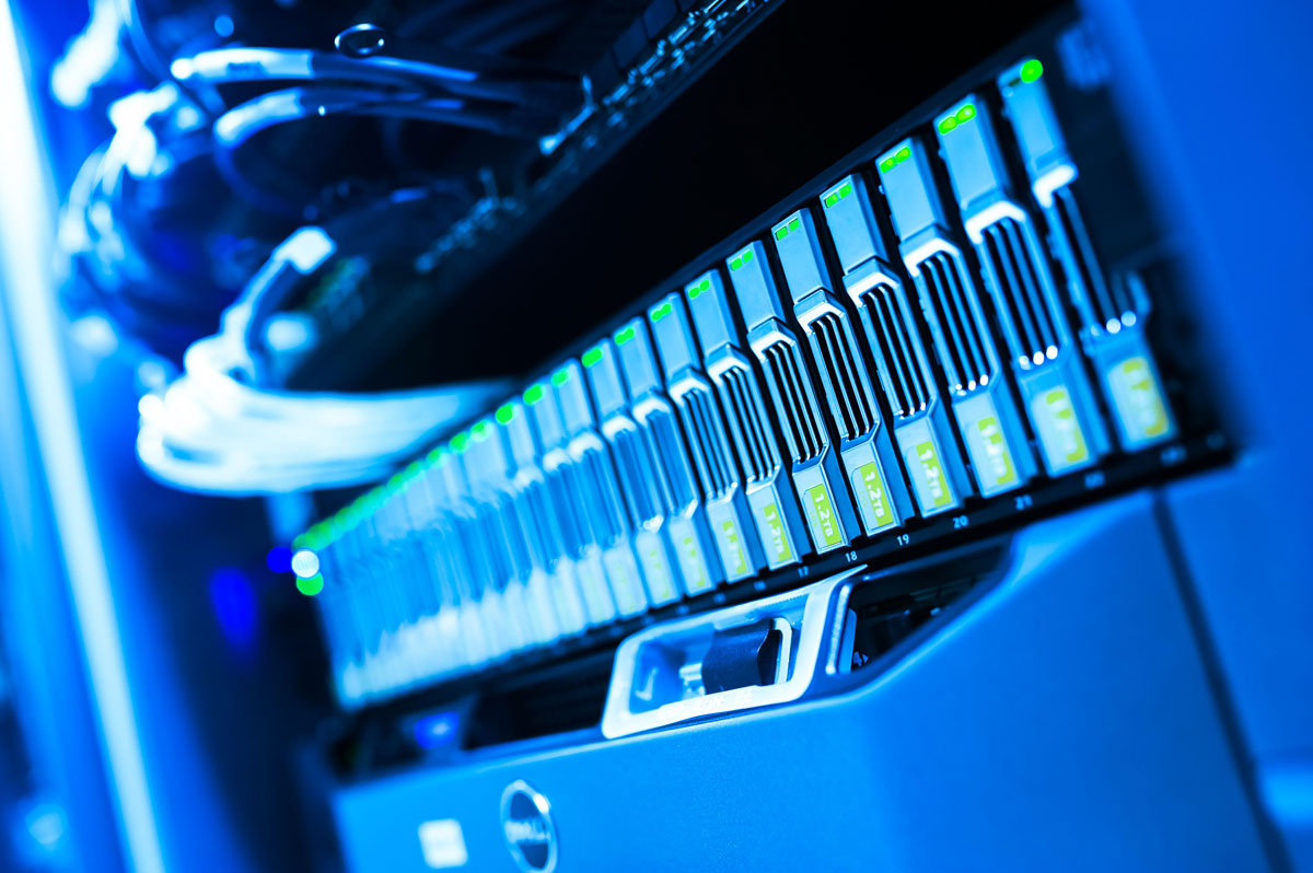 A detailed view of a blue lit computer server rack in a data center showcasing technology and hardware