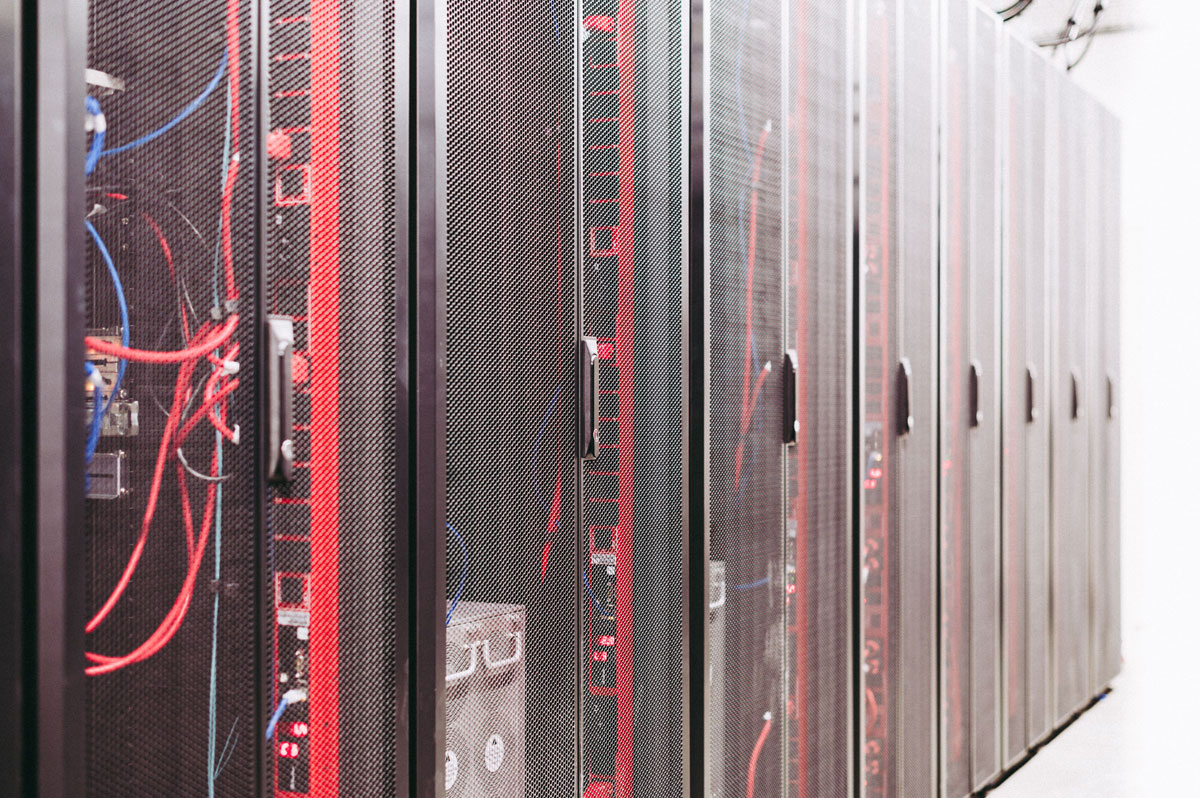 Modern data server room with network racks and cables