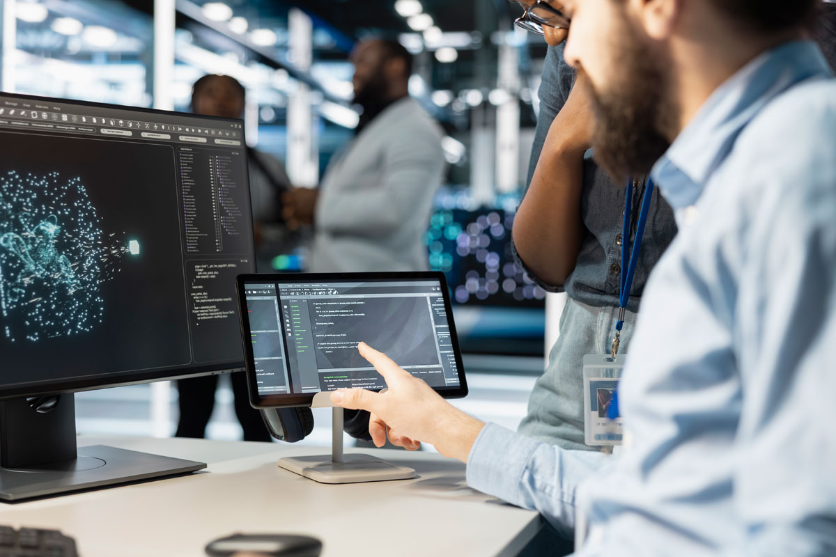 Close up of computer scientists in data center office using ai automation tools